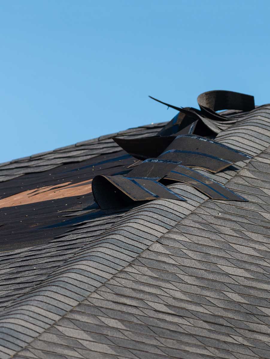 a roof with shingles blown off