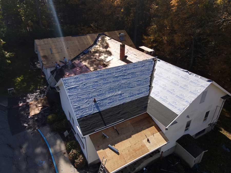 birds eye view of a roof replacement in progress on large building
